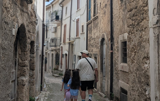 Me with my twin girls walking the streets of the village