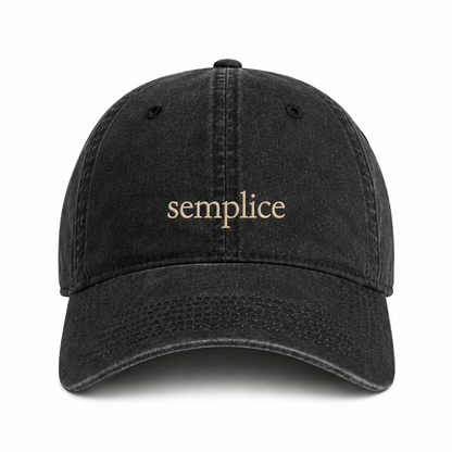 A black washed baseball cap with the word 'semplice' embroidered in a light beige serif font on the front, shown against a plain white background.